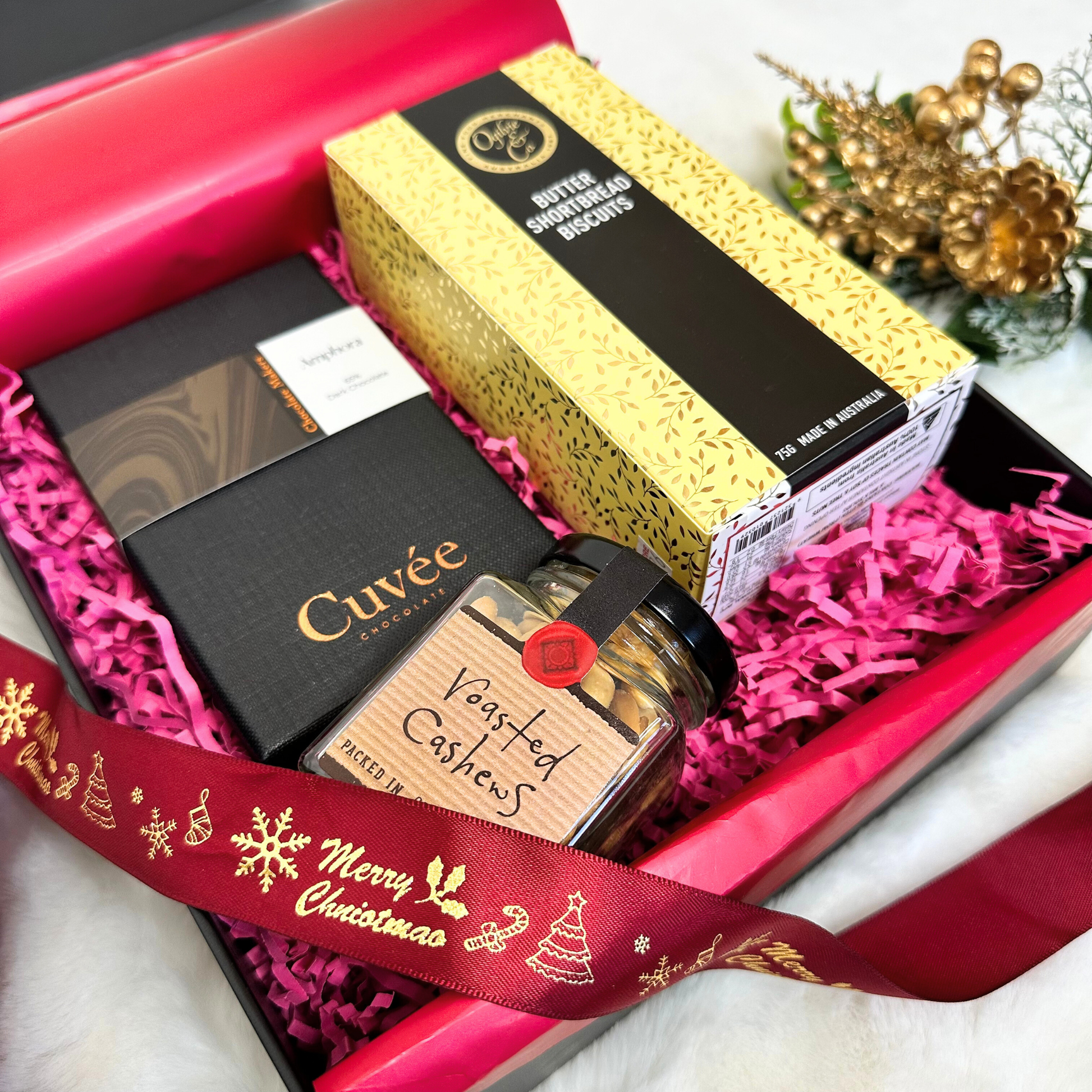 Xmas Gourmet Gift Hamper featuring Cuvee Chocolate Mini Wine Connoisseurs chocolates, Morish Savoury Nuts, and Sticky Date Walnut & Chia Artisan Cookies