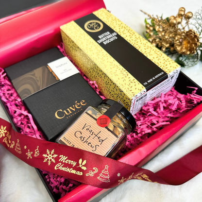 Xmas Gourmet Gift Hamper featuring Cuvee Chocolate Mini Wine Connoisseurs chocolates, Morish Savoury Nuts, and Sticky Date Walnut & Chia Artisan Cookies