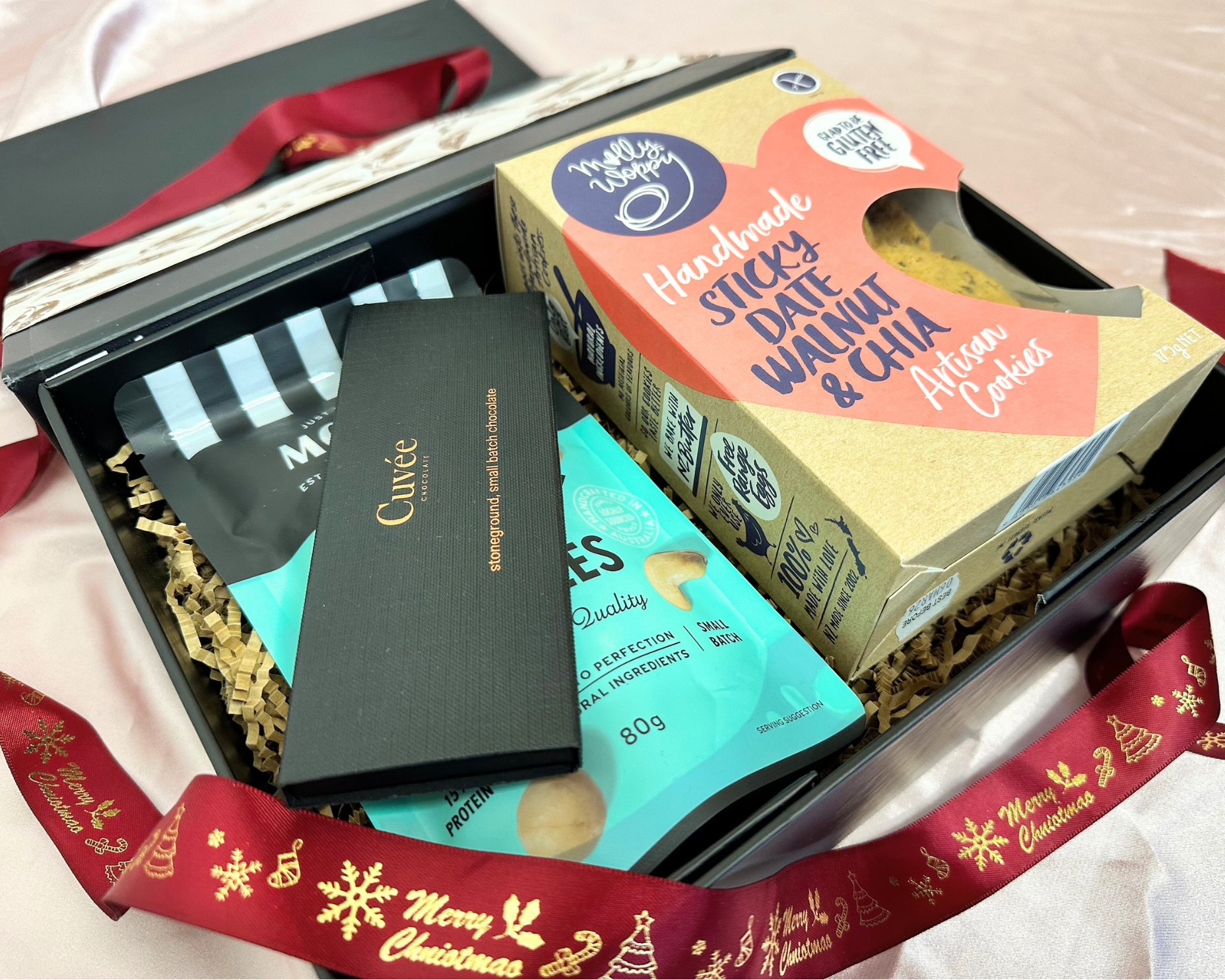 Xmas Gourmet Gift Hamper featuring Cuvee Chocolate Mini Wine Connoisseurs chocolates, Morish Savoury Nuts, and Sticky Date Walnut & Chia Artisan Cookies