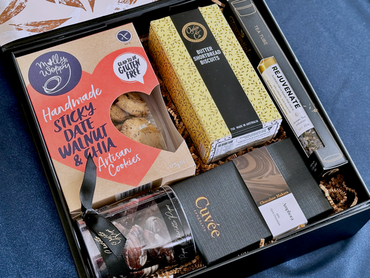 The Artisan Treat Box with premium chocolates, cookies, and tea