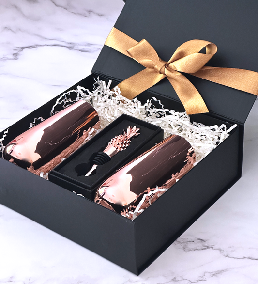 gift hamper contains two set flute and pinneapple bottle stopper