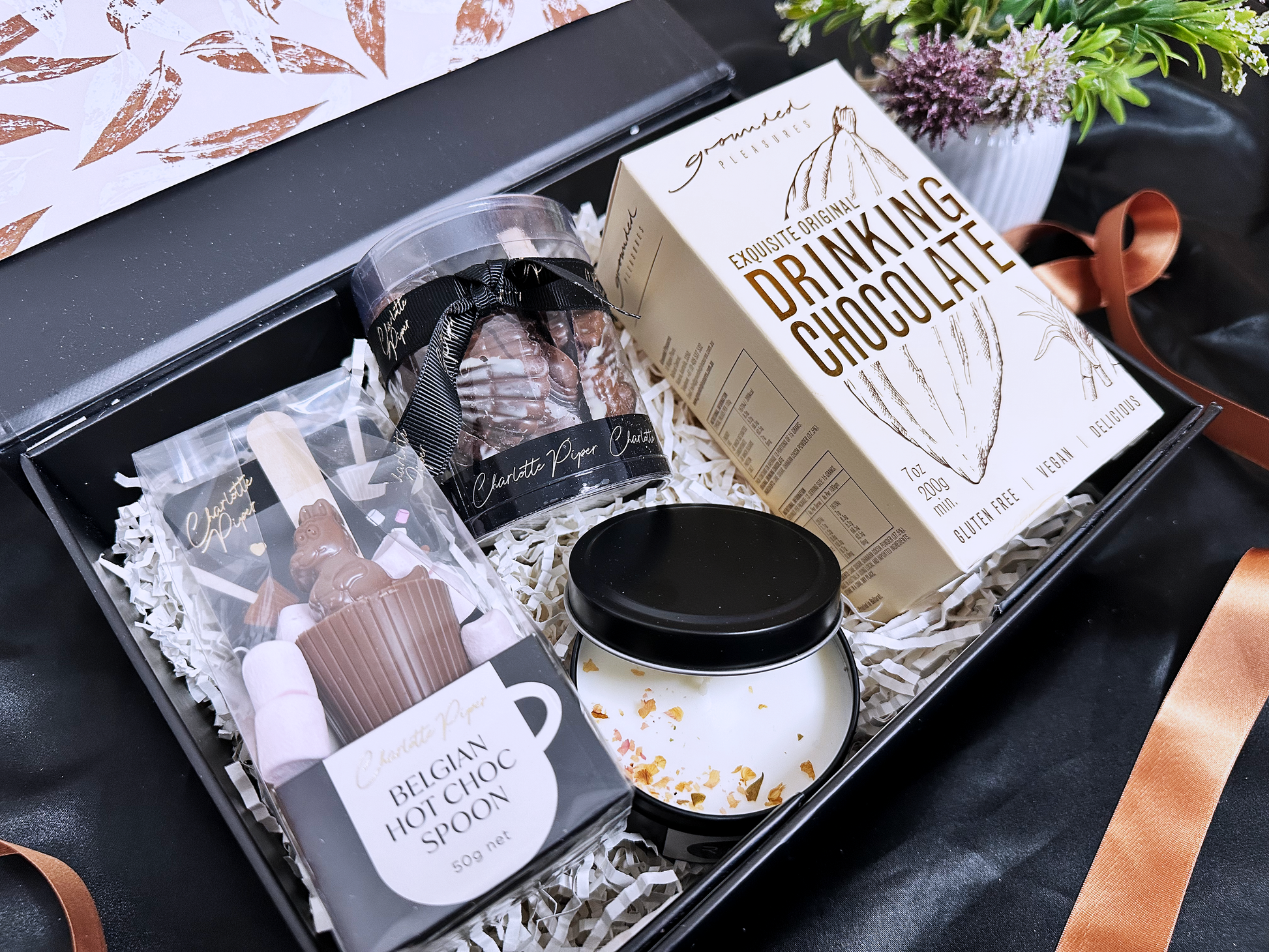 Gift set with drinking chocolate, candle and chocolate in a box.