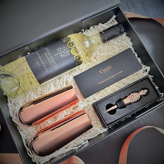 sidewood blanc wine with champagne flutes, cuvee chocolate and pineapple shaped stopped